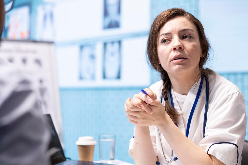 Physician meets with a patient to discuss medical results in a cabinet